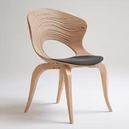 a wood chair with a black seat and wooden frame