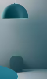 a blue lamp is hanging in a gray room