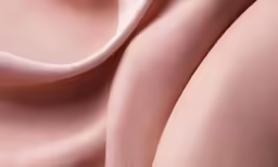 a close up image of pink silk