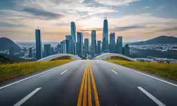 there is a road leading to a tall city in the background