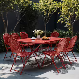 red outdoor furniture, sitting around a round table with four chairs