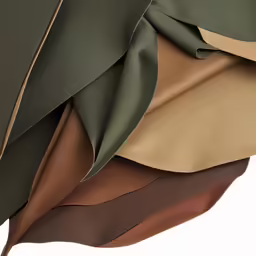 an assortment of color fabrics and fabrics are piled up together