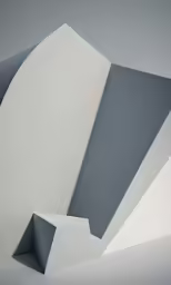 a sculpture with curves is seen on the wall