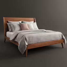 an empty bed with pillows, blanket and pillow cases