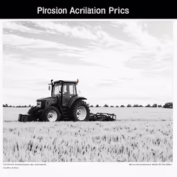the tractor is pulling a trailer behind it in a field
