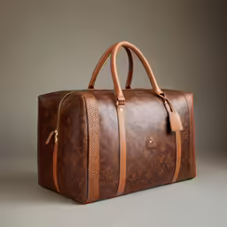 brown and tan handbag sitting on top of grey floor