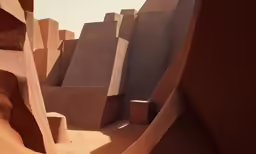 a desert with buildings made of rocks on each side