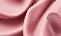 the background is pink silk, it looks like an elegant material