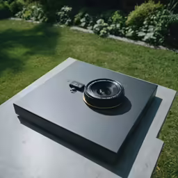 an external camera sitting on top of a book