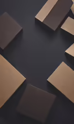 square brown stickers scattered out on a black surface