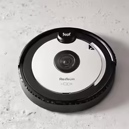 a robot is sitting on a white floor