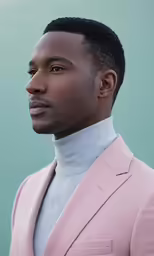 a black man in a pink suit and tie