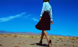 the girl in the skirt is walking away
