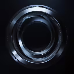 a close up view of the metal ring on a black background