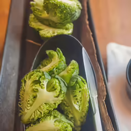 broccoli florets in small spoons ready for serving