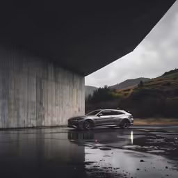 a bmw car sitting by a large building