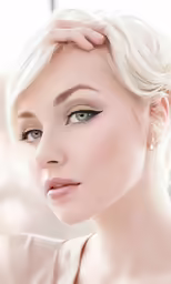 woman with long white hair and eye makeup