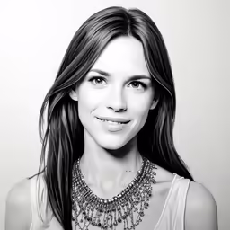 an image of a woman smiling in black and white