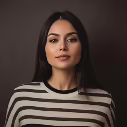 woman with eyes closed with stripes sweater