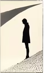 black and white photo of a man wearing a coat standing on a hill