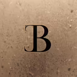 a picture of the letter b with some water droplets