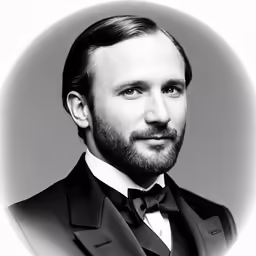 a man in a black tie and bow tie