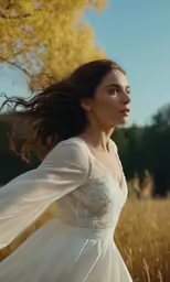 woman in white dress with hands in her hair