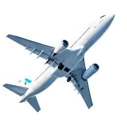 a large passenger jet flying through a white sky