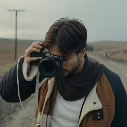 a man taking a photo with his digital camera
