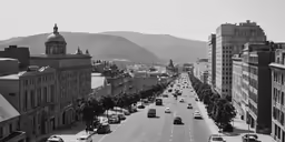 a long city street has cars on it