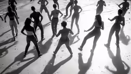 a group of people that are standing in the sand