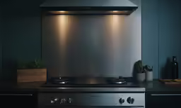 a modern style stove top is on a black counter
