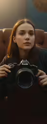 the girl has a camera over her shoulder