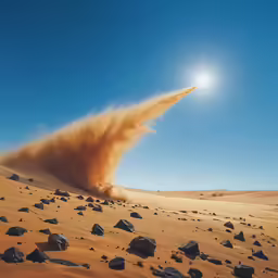 the sun in a bright blue sky over rocks