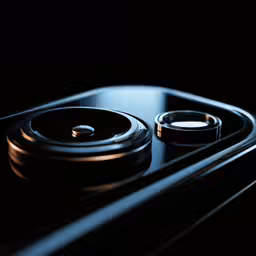 two black knobs are on the front of an apple phone