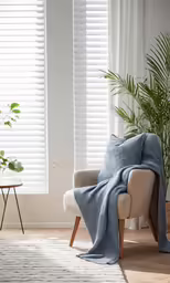 a chair and a window covered with a blue blanket
