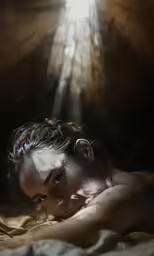 man resting on a bed under a beam