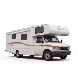 a travel trailer sitting on top of a white surface