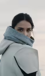 a woman with an undershirt wrapped around her
