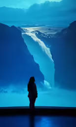 a person is standing in front of a large wall