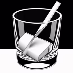 a black and white photo of a toothbrush and an empty glass