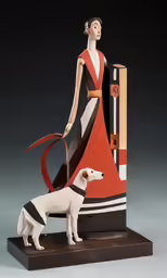 a mannequin dressed in an elegant gown is posed next to a white dog