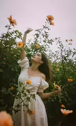 a beautiful woman wearing white is standing in a field of flowers