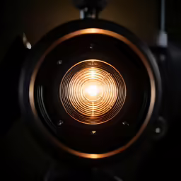 a bright light on top of a camera in the dark