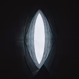 some kind of window in a building with sky and clouds