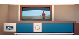 a person standing in the middle of an empty room, looking at the tv screen