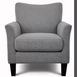 a chair with a black legs sitting next to a white wall