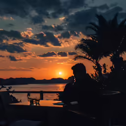 people dining on a sunset outside of a restaurant