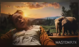 a woman is laying on the floor in front of an image of an elephant