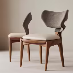 a pair of chairs with white upholstered cushions